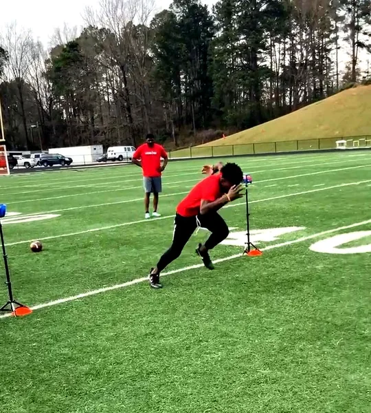 Athlete sprinting through Lockerroom laser timing gates